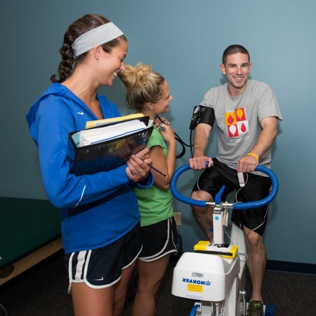 students administer tests on a student athelete